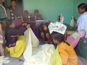 Students sowing at the KIRF Sewing Center