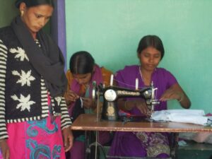 Students sowing at the KIRF Sewing Center