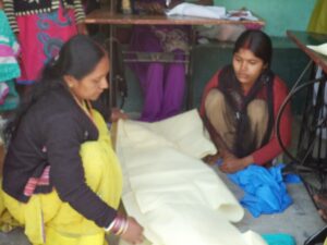 Students sowing at the KIRF Sewing Center