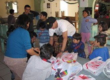 A house deep in the hills of Tijuana that provides a safe haven for these women and their children to recuperate from an abusive household. This photo shows Mark Kirwin delivering supplies of toys and clothes to the women and children of this safe house.