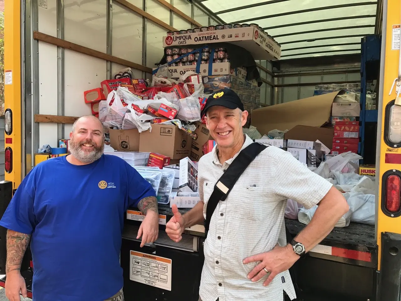 Volunteers loading a disaster relief supply truck