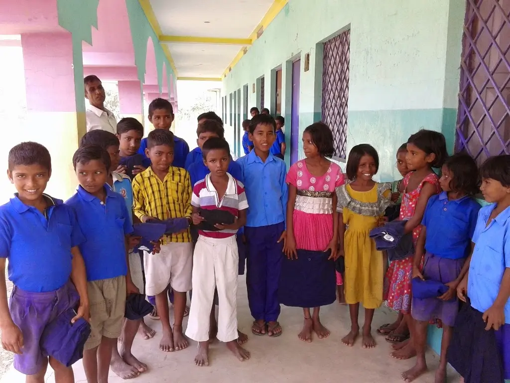 Schoolchildren in a colorful hallway in Bihar, India